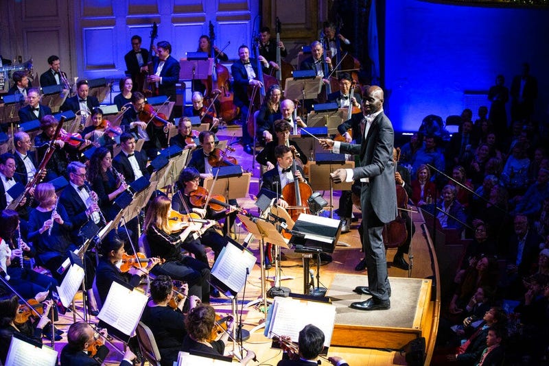 Boston Celtics player Tacko Fall makes his debut as a guest conductor during the renowned Boston Pops orchestra's holiday concert in Boston. The 7-foot-6 center took the stage to lead the orchestra in a rendition of the song “Sleigh Ride" at Boston's Symp