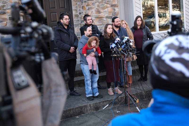 Surrounded primarily by family, Nicky Kohen, the daughter of Josef Neumann who was critically injured in an attack on a Hanukkah celebration, speaks to reporters in front of her home in New City, N.Y., Thursday, Jan. 2, 2020.