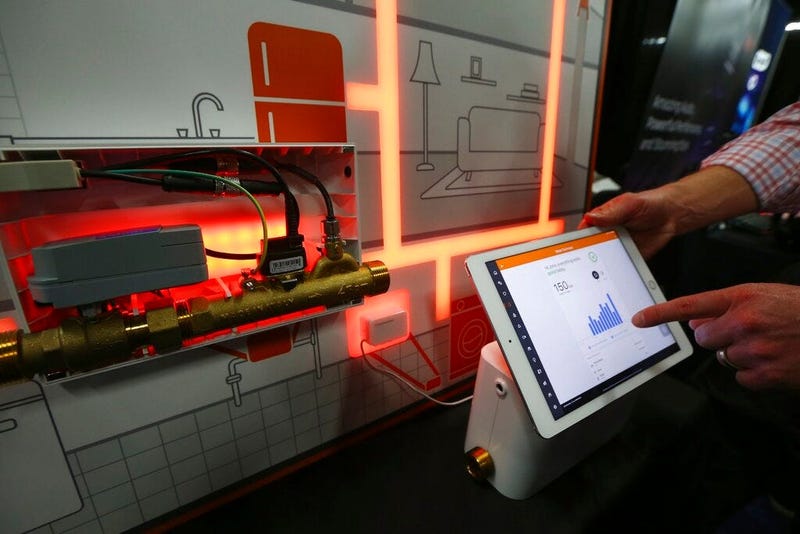 The Alarm.com water management smart water valve is shown here with the app at the CES Unveiled media preview event, Sunday, Jan. 5, 2020, in Las Vegas.