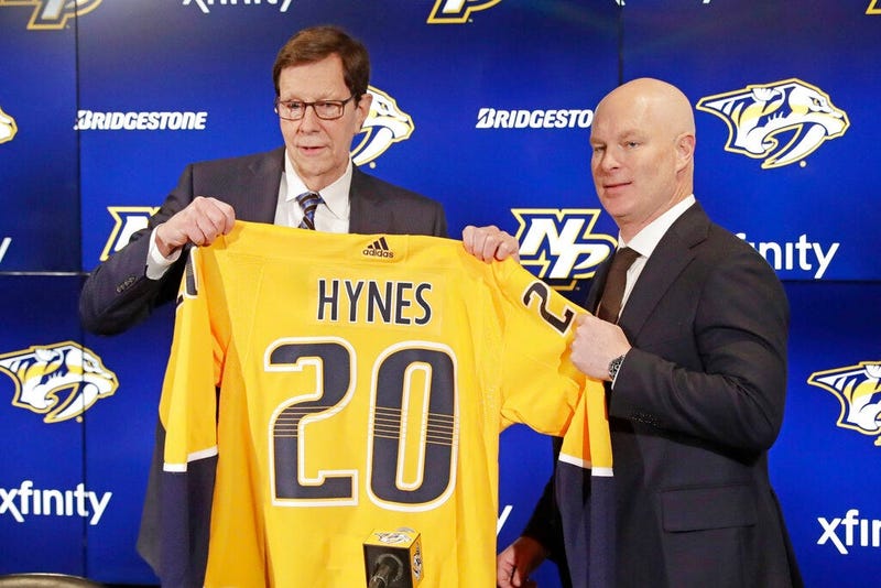 New Nashville Predators NHL hockey team head coach John Hynes, right, poses for photos with Predators general manager David Poile at a news conference Tuesday, Jan. 7, 2020, in Nashville, Tenn. The Predators hired Hynes, the former New Jersey Devils coach