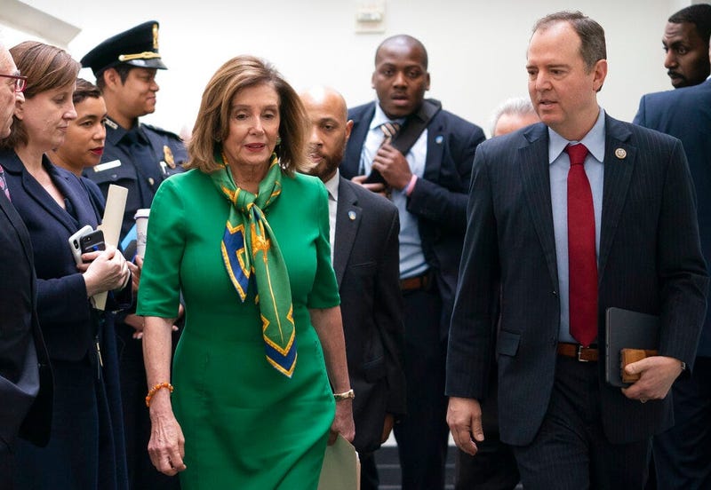 Speaker of the House Nancy Pelosi, D-Calif., joined by House Intelligence Committee Chairman Adam Schiff, D-Calif., leaves a closed-door meeting with the Democratic Caucus at the Capitol, Tuesday, Jan. 14, 2020. (AP Photo/J. Scott Applewhite)