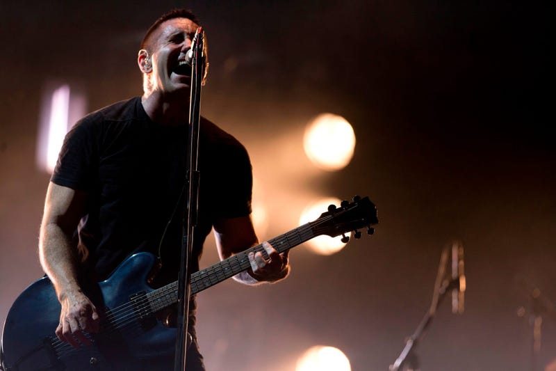 In this March 27, 2014 file photo, Trent Reznor of Nine Inch Nails performs at the Vive Latino music festival in Mexico City, Mexico. 