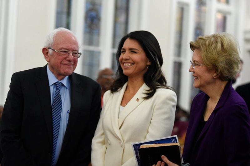 US. Sen. Bernie Sanders, left, I-Vt., U.S. Rep. Tulsi Gabbard, center, D-Hawaii, and Sen. Elizabeth Warren, right, D--Mass., speak at a Martin Luther King Jr. Day services at Zion Baptist Church, Monday, Jan. 20, 2020, in Columbia, S.C.