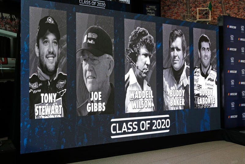 images of NASCAR's Hall of Fame Class of 2020, from left, Tony Stewart, Joe Gibbs, Waddell Wilson, Buddy Baker and Bobby Labonte are shown on a screen after an announcement in Charlotte, N.C. 