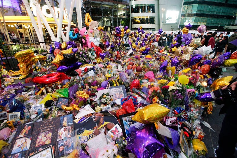 Fans gather at a memorial for the late Kobe Bryant in front of Staples Center in Los Angeles, Sunday, Feb. 2, 2020. Bryant, the 18-time NBA All-Star who won five championships and became one of the greatest basketball players of his generation during a 20