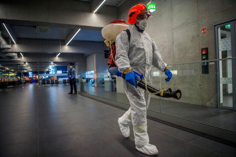 Disinfection equipment is carried by a worker as precautionary measures against the spreading of novel coronavirus, at Budapest Liszt Ferenc International Airport in Budapest, Hungary, Wednesday, Feb. 5, 2020. So far almost 900 passenger arriving directly