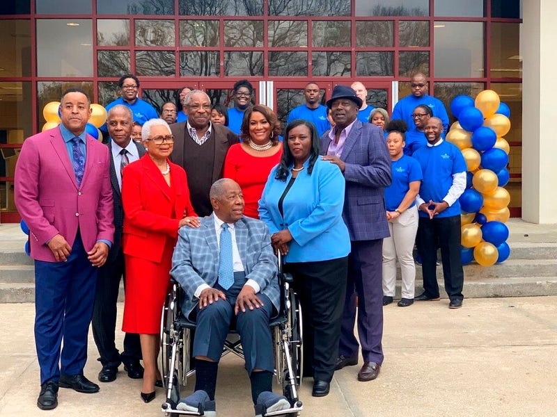 Former Atlanta Braves slugger Hank Aaron, center, is surrounded by family and friends as Atlanta Technical College celebrates his 86th birthday, Wednesday, Feb. 5, 2020 in Atlanta. 