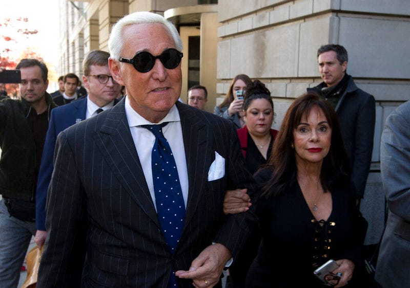 Roger Stone, left, with his wife Nydia Stone, leaves federal court in Washington, Friday, Nov. 15, 2019. Federal prosecutors are asking a judge to sentence Stone to serve between 7 and 9 years in prison after his conviction on witness tampering and obstru