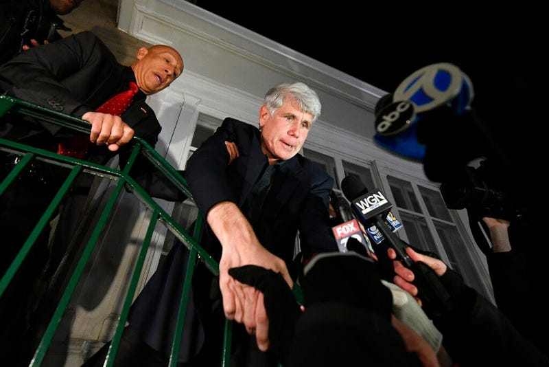 Former Illinois Gov. Rod Blagojevich shakes hands with a supporter as he arrives home in Chicago on Wednesday, Feb. 19, 2020, after his release from Colorado prison late Tuesday.