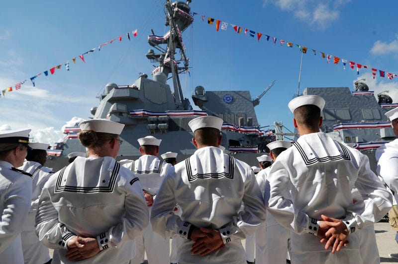 FILE - In this Saturday, July 27, 2019, file photo, sailors stand during a commissioning ceremony for the U.S. Navy guided missile destroyer USS Paul Ignatius, at Port Everglades in Fort Lauderdale, Fla.