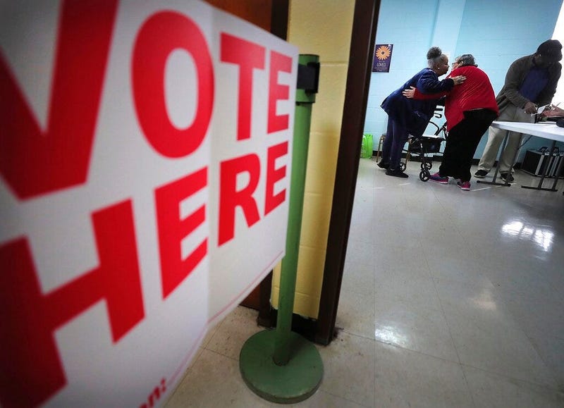 Poll worker Joyce Bradley, left, embraces Ruby Rosenthal, a former poll worker, at the Bellevue Frayser Church polling location as voters go to the polls on Tuesday, March 3, 2020, to vote in the Super Tuesday primaries.