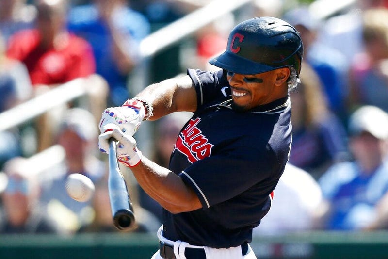 Cleveland Indians' Francisco Lindor connects for a home run against the Chicago Cubs during the first inning of a spring training baseball game Saturday, March 7, 2020, in Goodyear, Ariz. 