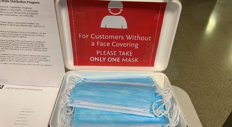 Masks offered for SEPTA riders at Suburban Station. 
