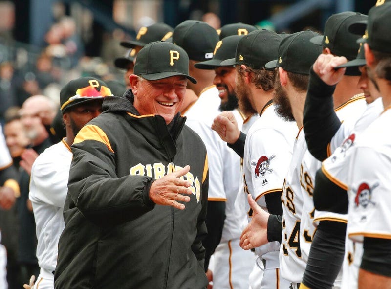 Pittsburgh Pirates' Clint Hurdle, left, greets players as he ins introduced before the Pirates' home opener baseball game against the Minnesota Twins in Pittsburgh.