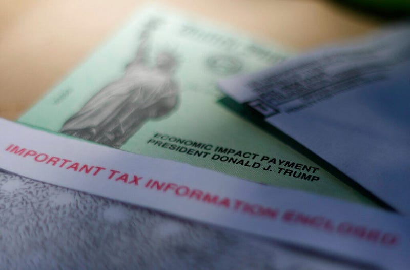 FILE - This April 23, 2020, file photo shows President Donald J. Trump's name printed on a stimulus check issued by the IRS to help combat the adverse economic effects of the new coronavirus outbreak in San Antonio. (AP Photo/Eric Gay, File)