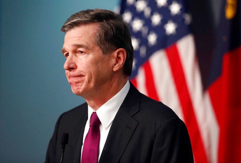North Carolina Gov. Roy Cooper listens to a question during a briefing on the coronavirus pandemic at the Emergency Operations Center in Raleigh, N.C., Thursday, May 28, 2020. 