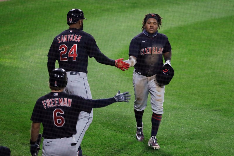 Ramirez gets congratulated after scoring on squeeze play