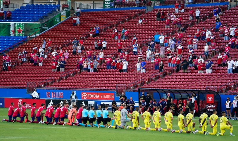 FC Dallas and Nashville SC players kneel during the national anthem
