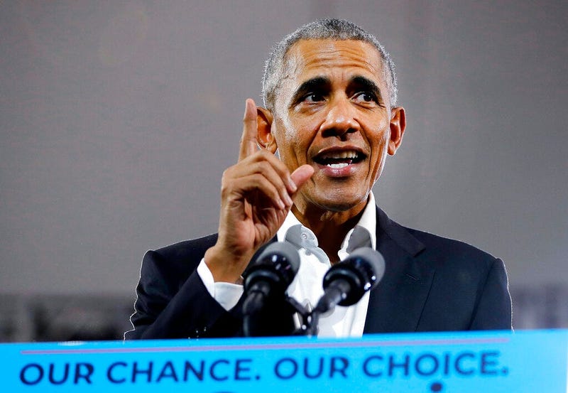 Former President Barack Obama steps on stage to speak during a campaign rally for Georgia gubernatorial candidate Stacey Abrams