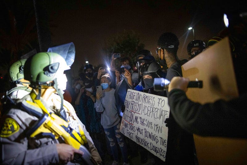 Protesters clash with deputies of the Los Angeles Sheriff's Department during protests following the death of Dijon Kizzee (AP)