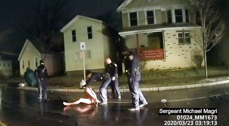 Rochester police officer puts a hood over the head of Daniel Prude (AP)