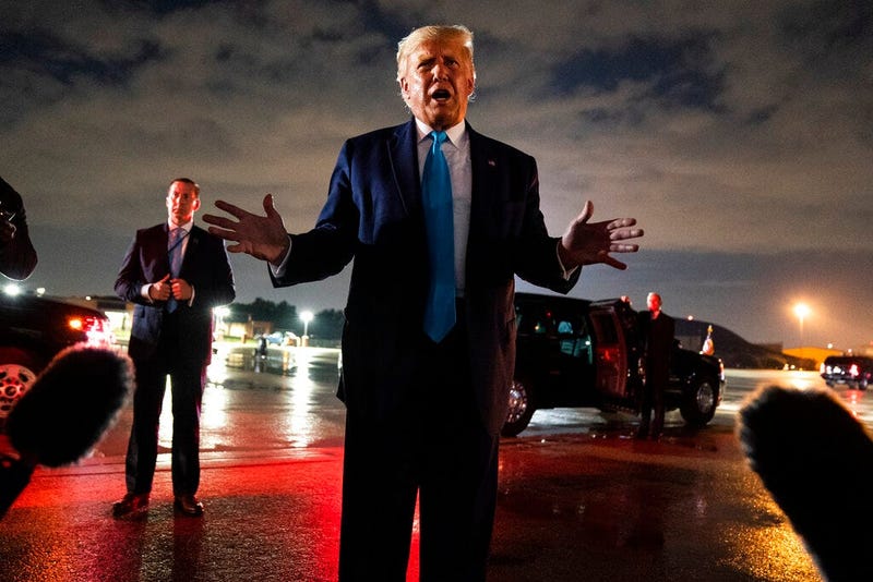 President Donald Trump talks with reporters at Andrews Air Force Base (AP)