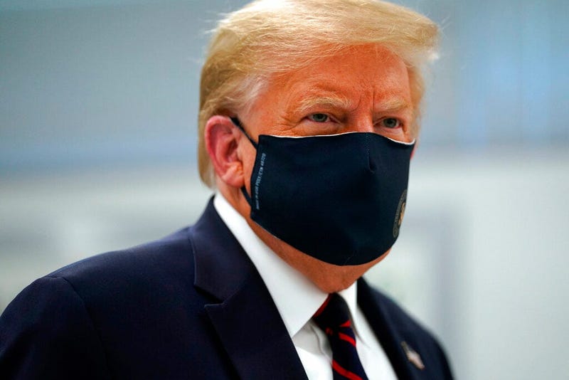 Donald Trump appears in a mask