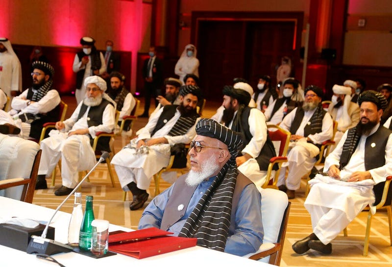 In this Sept. 12, 2020, file photo, Taliban negotiator Abbas Stanikzai, center front, and his delegation attend the opening session of peace talks between the Afghan government and the Taliban