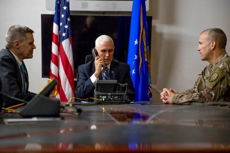 File photo Vice President Mike Pence, accompanied by U.S. Ambassador to Iraq Matthew Tueller, left, and Lt. Gen. Pat White, right, takes a phone call with Iraqi Prime Minister Adil Abdul-Mahdi at Al Asad Air Base, Iraq. (AP Photo/Andrew Harnik, File)