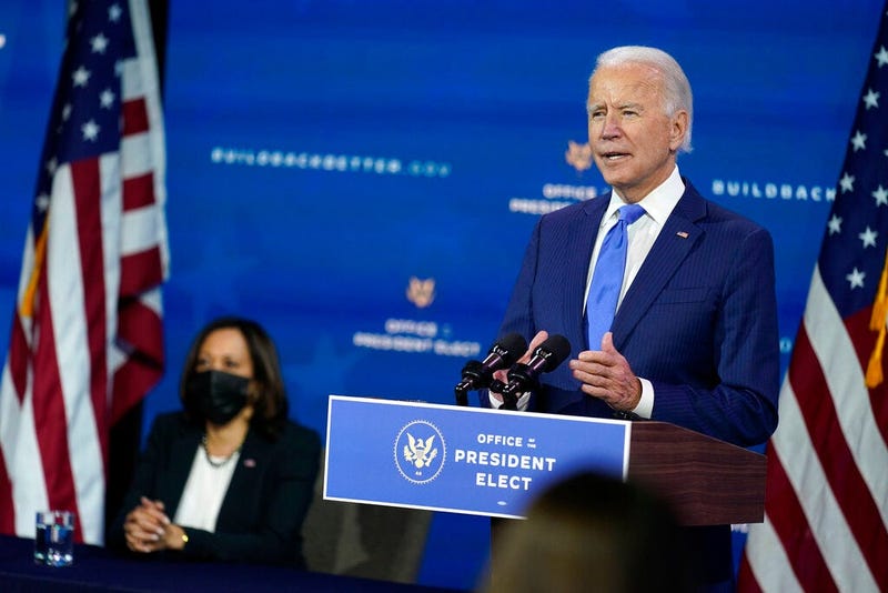President-elect Joe Biden speaks as Vice President-elect Kamala Harris listens at left, during an event to introduce their nominees to economic policy posts at The Queen theater, Tuesday, Dec. 1, 2020, in Wilmington, Del. (AP Photo/Andrew Harnik)