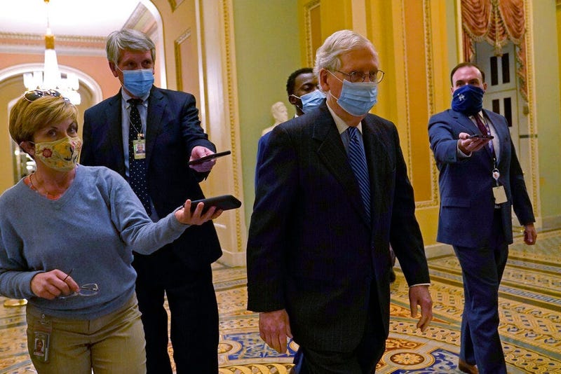 Senate Majority Leader Mitch McConnell of Ky., walks past reporters on Capitol Hill in Washington, Tuesday, Dec. 15, 2020. 