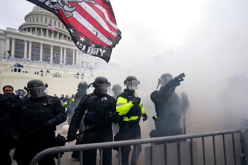 Police hold off Trump supporters who tried to break through a police barrier, Wednesday, Jan. 6, 2021, at the Capitol in Washington.