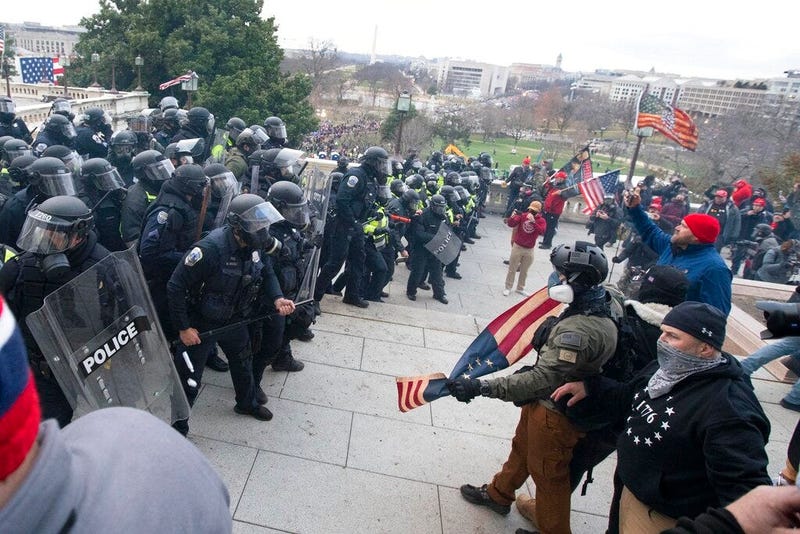 U.S. Capitol Police push back demonstrators who were trying to enter the U.S. Capitol on Wednesday, Jan. 6, 2021, in Washington.