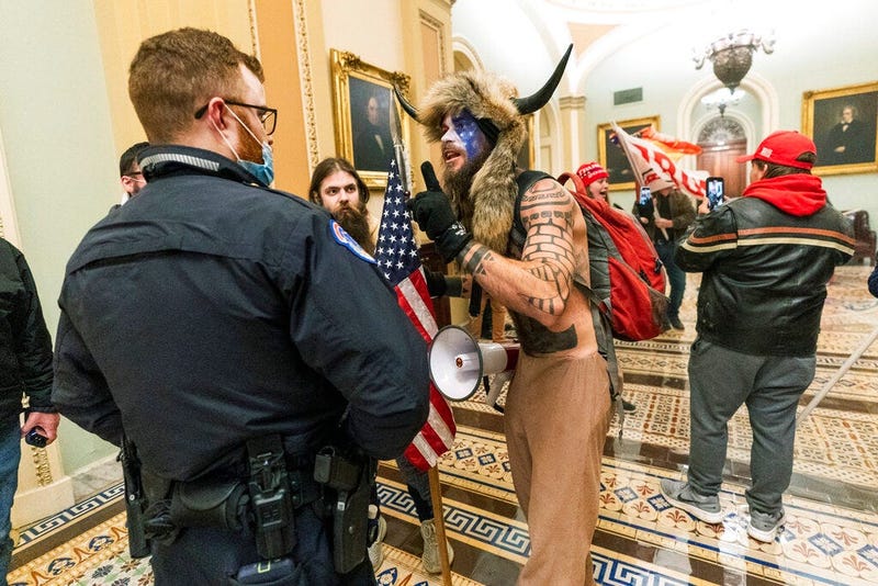 In this Jan. 6, 2021, file photo supporters of President Donald Trump are confronted by U.S. Capitol Police officers outside the Senate Chamber inside the Capitol in Washington. (AP Photo/Manuel Balce Ceneta, File)