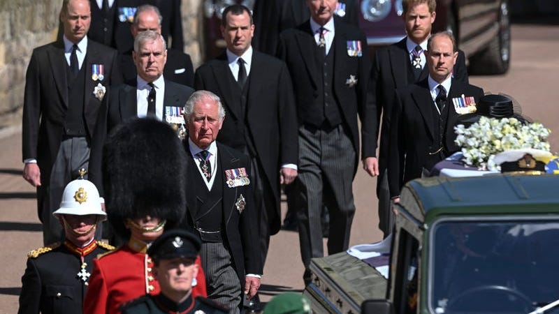 Prince Philip is laid to rest as somber queen sits alone
