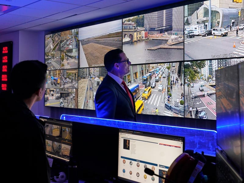 U.S. Secret Service Special Agent in Charge Matt McCool, center, looks at live video surveillance feeds in the agency's New York Field Office, in the Brooklyn borough of New York, Monday, Sept. 22, 2025