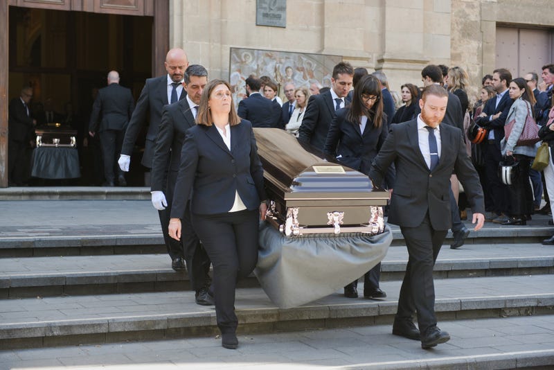 One of the coffins of the five members of the Siemens CEO's family is carried out of the church of Sant Vicenç de Sarria on April 22, 2025