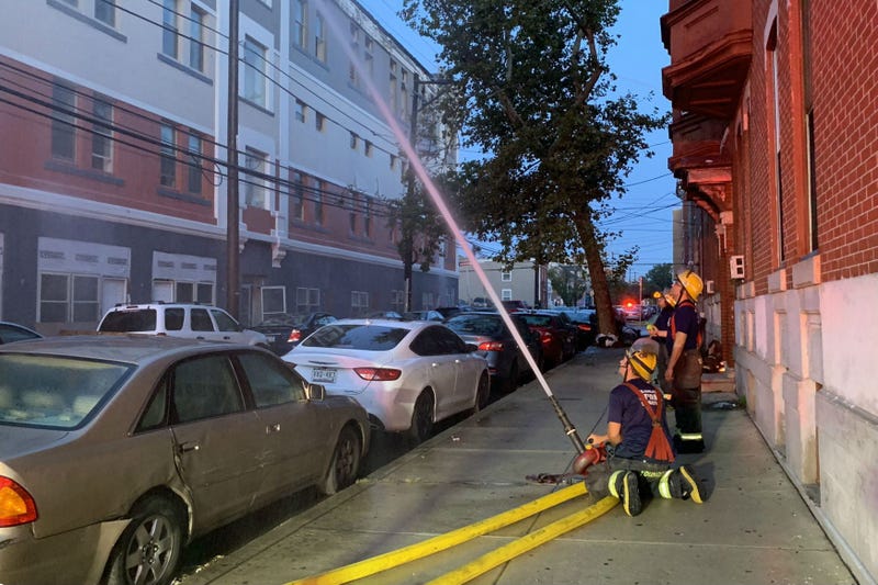 Philly firefighters still on scene hosing down hotspots at a vacant, 4-story apartment building at 1600 West Oxford Street in North Philadelphia.