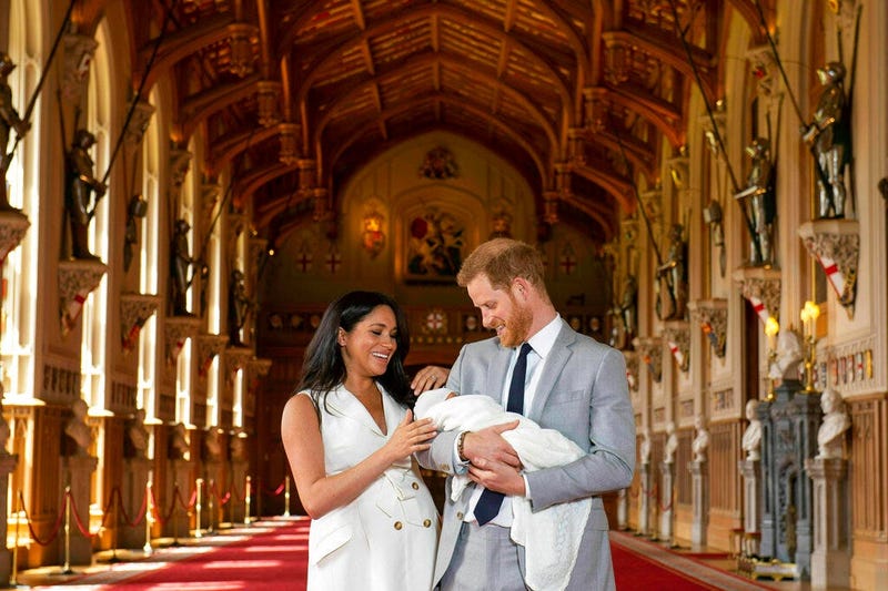 Prince Harry and Meghan with baby