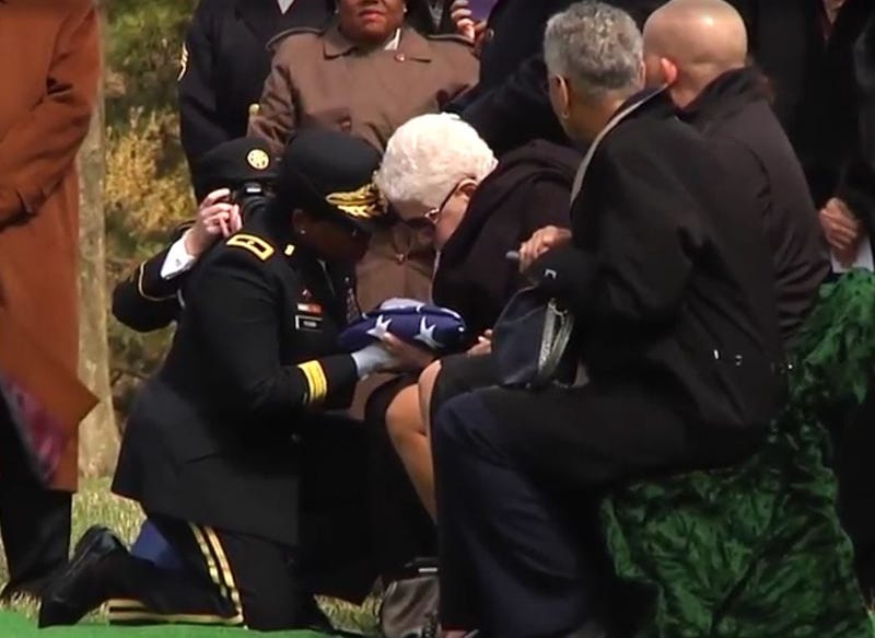 Marla Andrews presented the flag from her father's casket, Captain Lawrence Dickson.