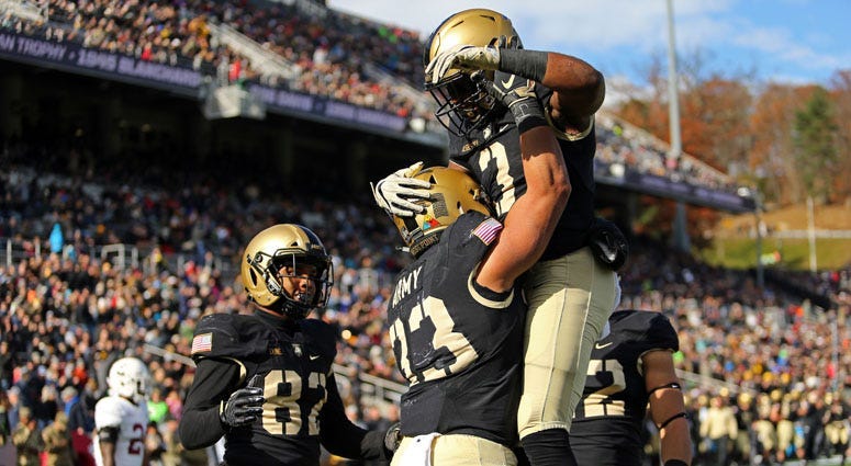 Army Black Knights running back Darnell Woolfolk (33) celebrates a touchdown with running back Jordan Asberry (3) against the Lafayette Leopards on Nov. 10, 2018, at Michie Stadium in West Point, New York.