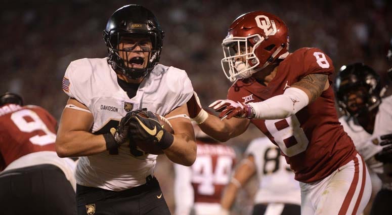 Army running back Andy Davidson scores a touchdown in front of Oklahoma safety Kahlil Haughton on Sept. 22, 2018, at Gaylord Family - Oklahoma Memorial Stadium in Norman, Oklahoma.