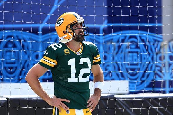 Aaron Rodgers looks up during a Packers-Saints game.