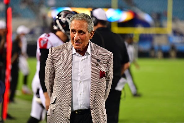 Arthur Blank paces along the sidelines during a Falcons game. 