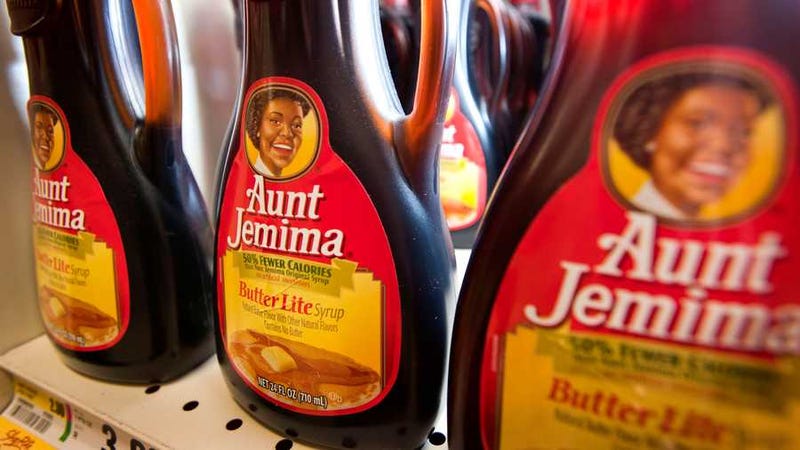 Bottles of Aunt Jemima brand syrup on a store shelf
