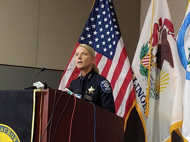 Aurora police speaking at presser