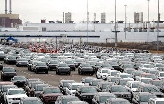 FILE - In this Feb. 26, 2019, file photo, Jeep vehicles are parked outside the Jefferson North Assembly Plant in Detroit. (AP Photo/Carlos Osorio, File)