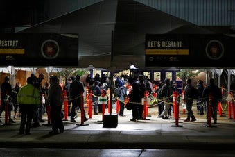 United Auto Workers return for the first work shift at the FCA Warren Truck Plant, Monday, May 18, 2020, in Warren, Mich. (AP Photo/Carlos Osorio)