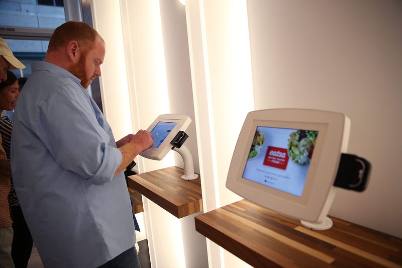 A customer uses an interactive kiosk to place orders at eatsa, a fully automated fast food restaurant on August 31, 2015 in San Francisco, California.