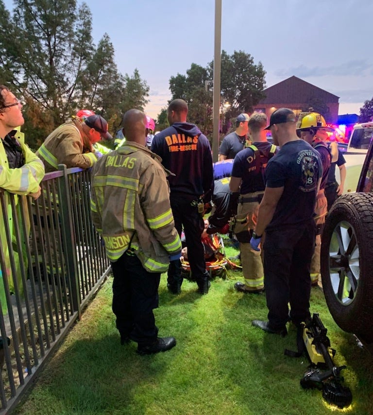 Crews rescue a man from the Jackson Branch of White Rock Creek in Dallas, Texas on Wednesday, June 5, 2024.